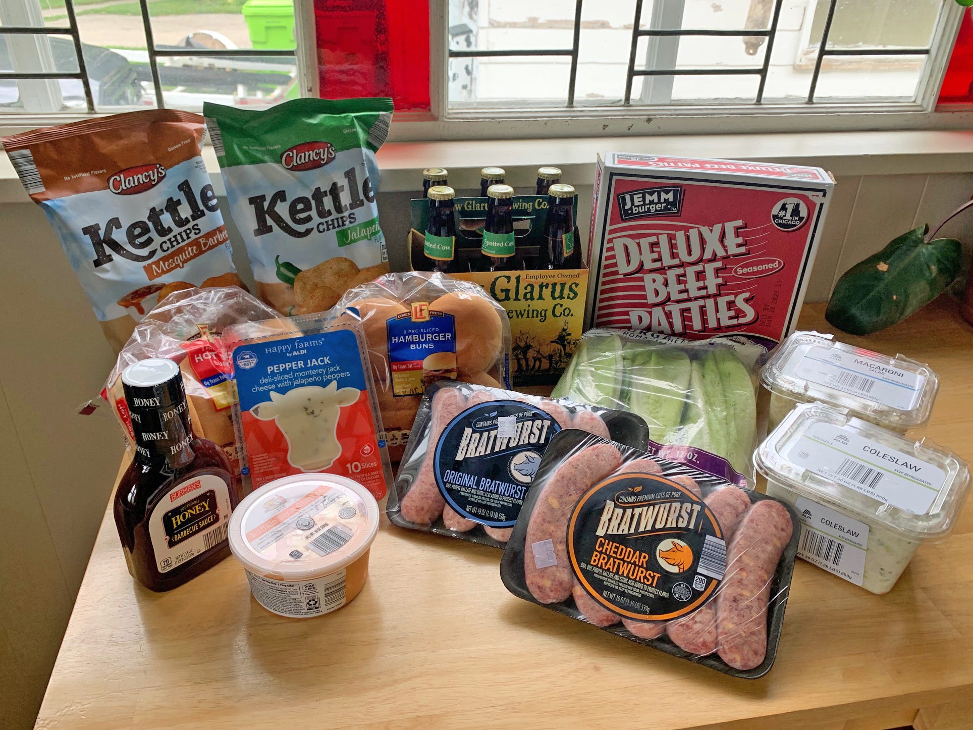 i-spent-$50-at-aldi-to-host-a-barbecue-for-4-people-my-budget-got-us-plenty-of-meat-and-sides,-plus-a-case-of-beer.